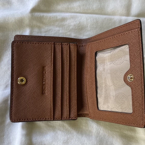Small Michael Kors wallet with card holders in great shape lightly used. - Picture 2 of 3